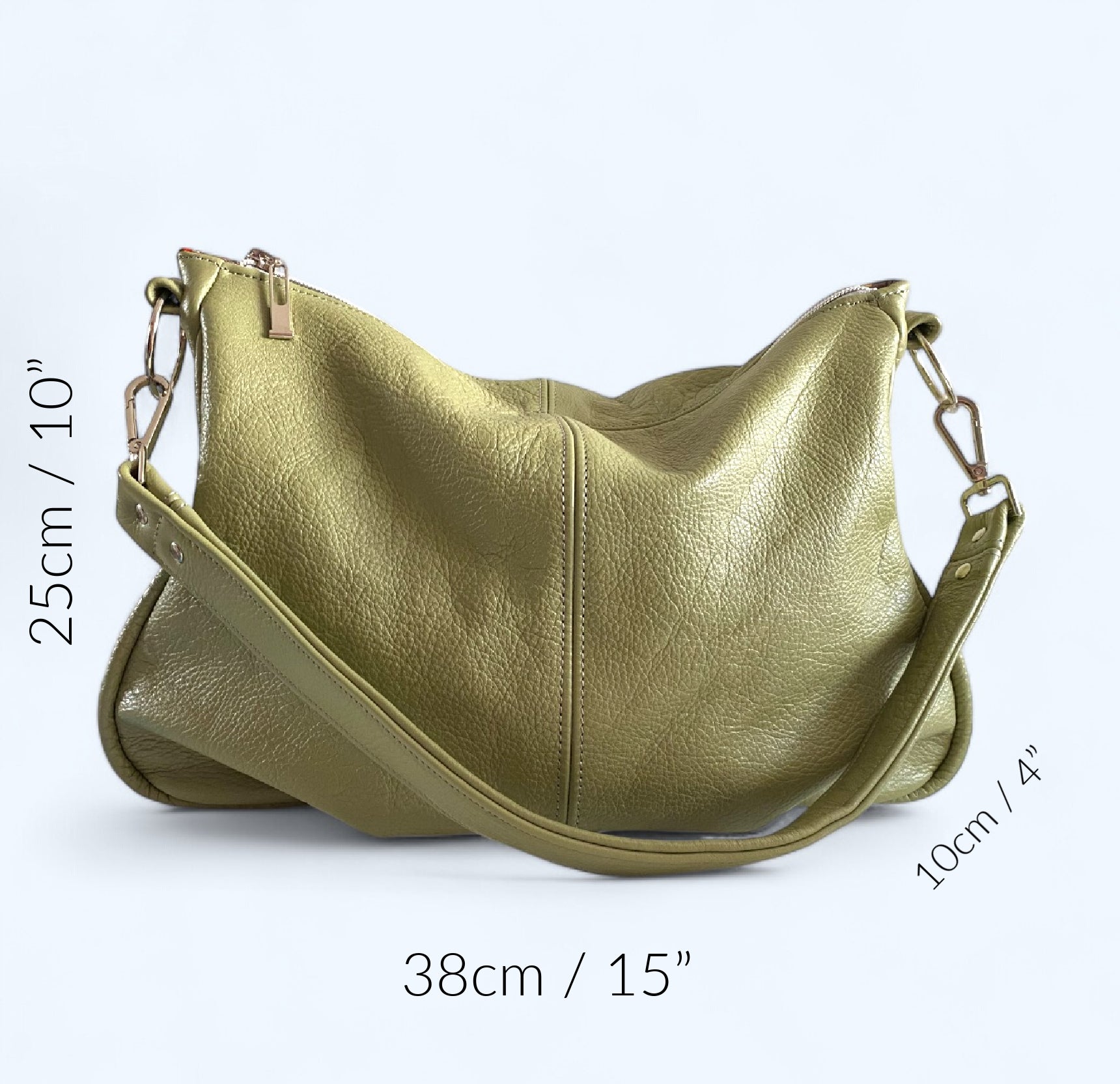 Pale green, upcycled leather slouchy bag sitting on a white background, with the measurements