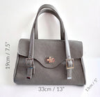 Grey real leather handbag and silver hardware with measurements on a white background