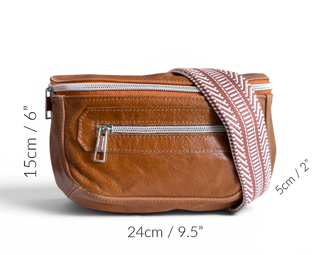 Tan brown leather bag with a strap, shown with measurements on a white background