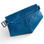 Blue leather clutch bag with buckle on white background