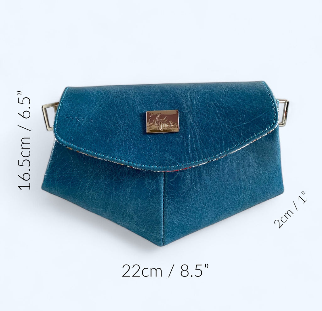 Blue handbag with measurements on a white background