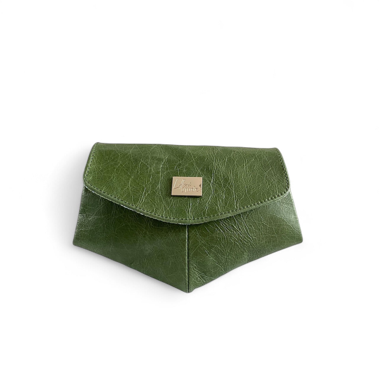 A forest green leather crossbody clutch bag with a magnetic snap closure and a small metal emblem on the front. 