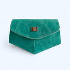 Bright turquoise leather clutch bag with a gold logo on a white background