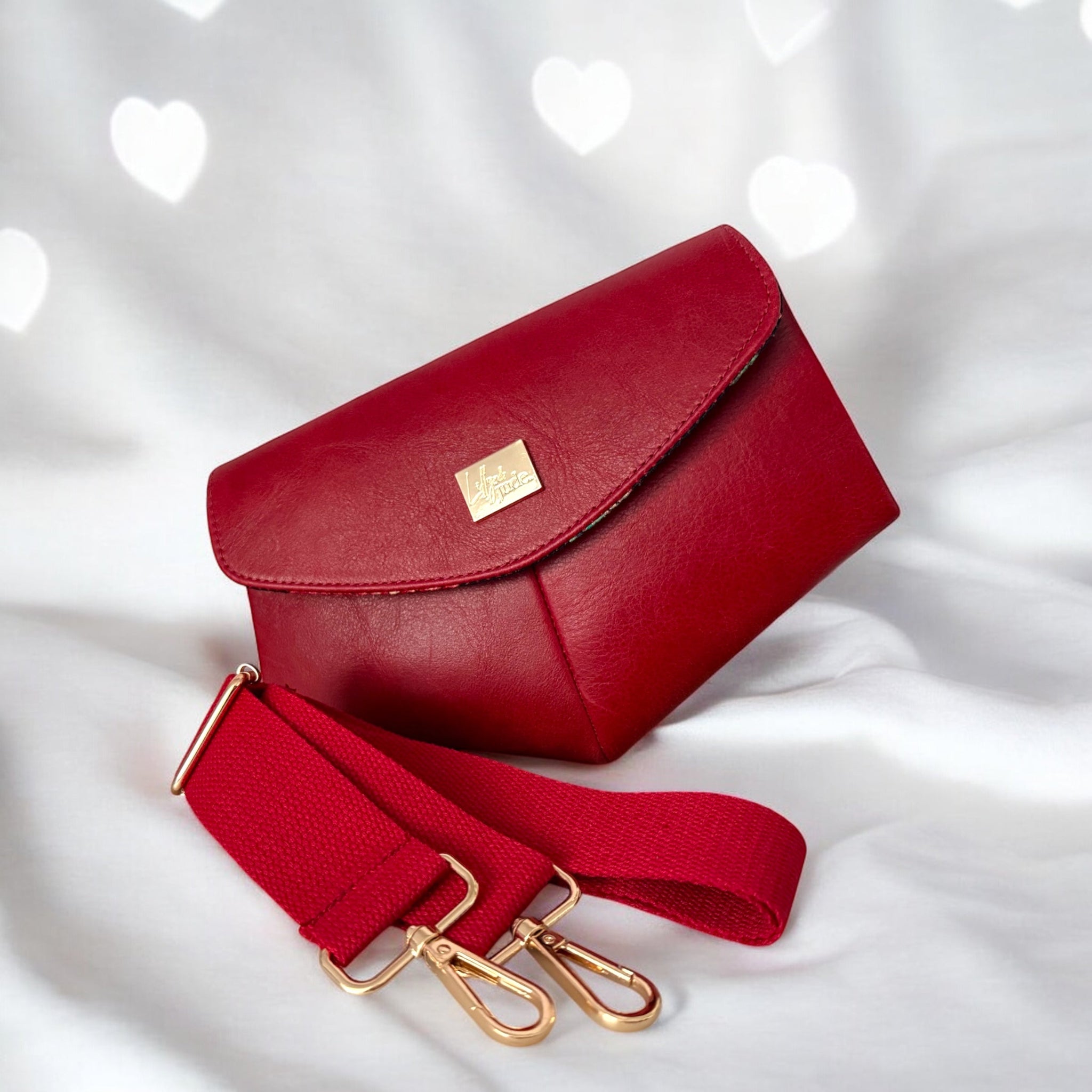 Red handbag cossbody handbag with gold clasp and matching woven strap
