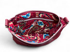 Open view revealing paisley patterned lining and highlighting the interior zipper pocket
