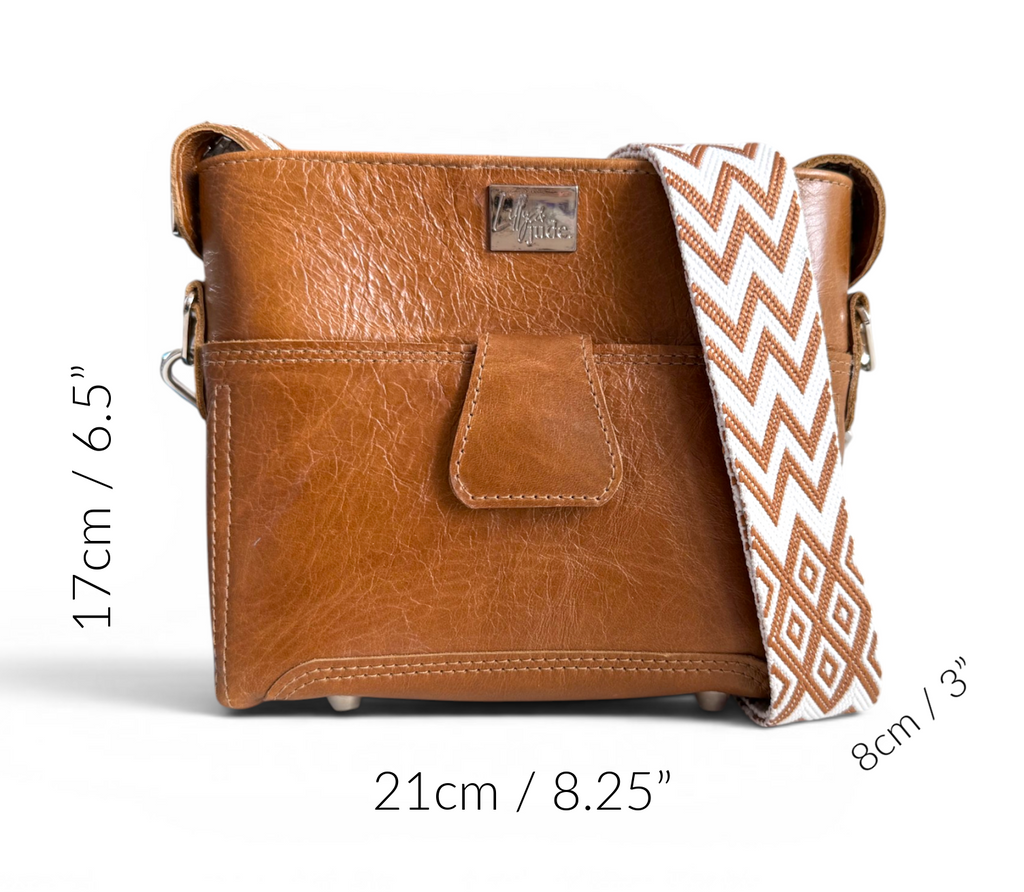 Tan brown leather crossbody bag with measurements on a white background
