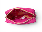 View of the top of a hot pink leather, small crossbody bag with floral interior on a white background
