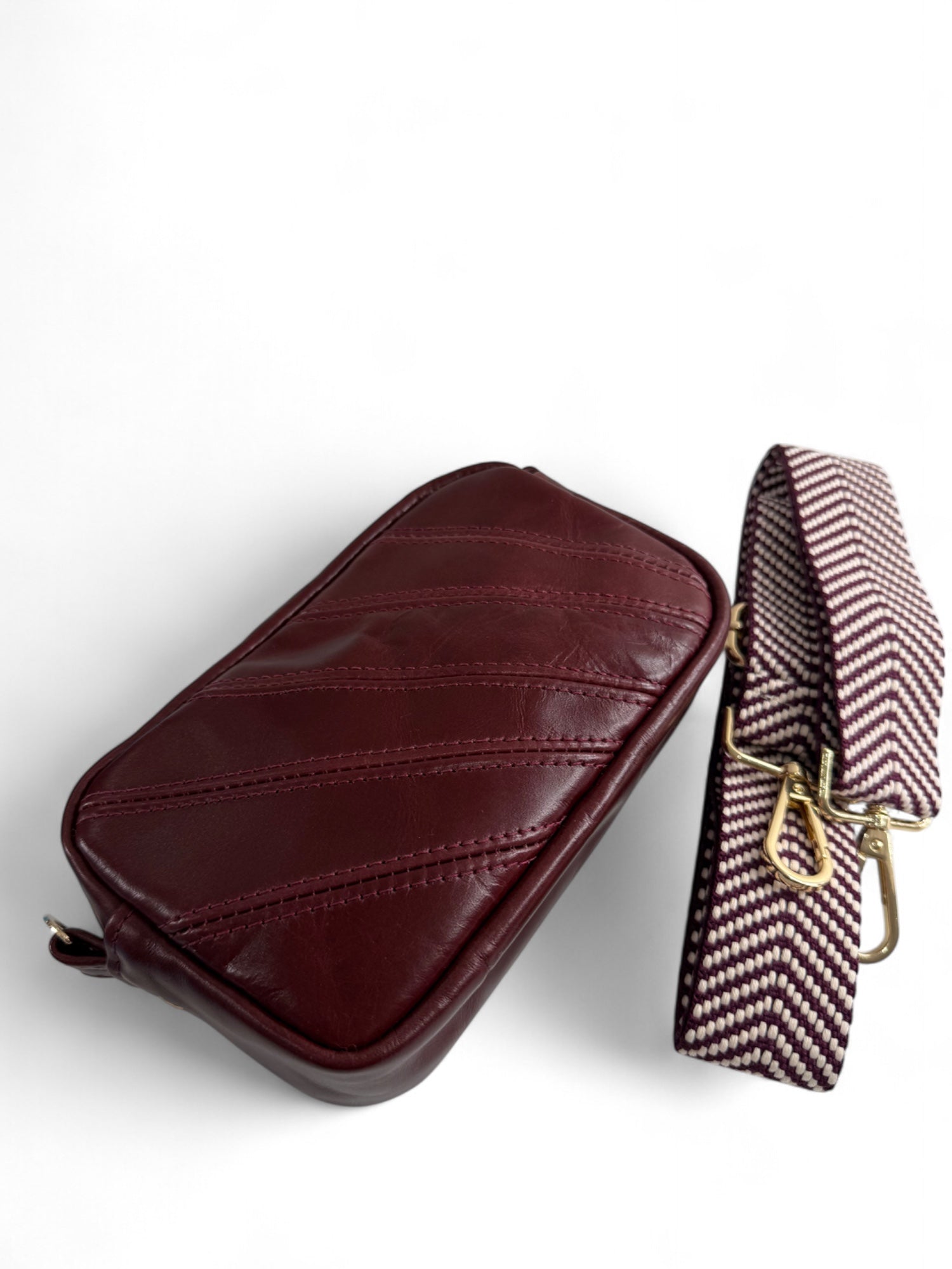 Upcycled burgundy Italian leather, compact crossbody bag with matching chevron patterned strap