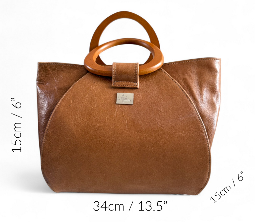 Brown leather handbag with wooden handles and size measurements on a white background.
