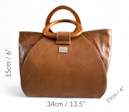 Brown leather handbag with wooden handles and size measurements on a white background.
