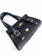 Navy blue leather handbag with silver buckles on a white background